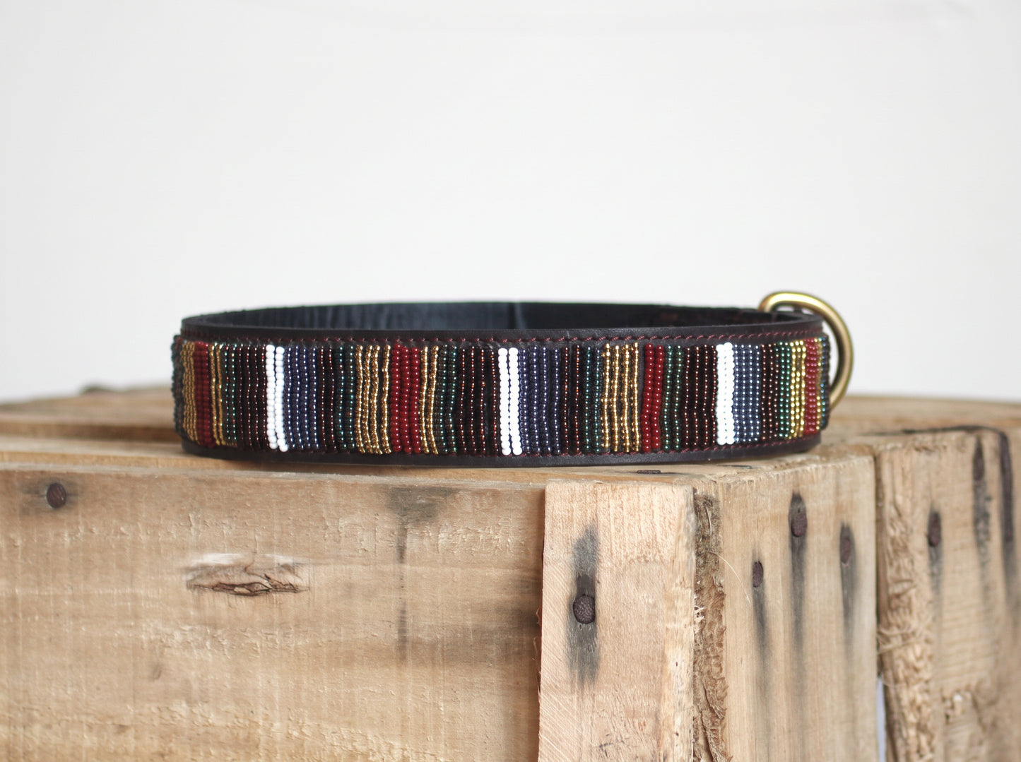 EL PASO beaded dog collar by COLLART on wooden crate