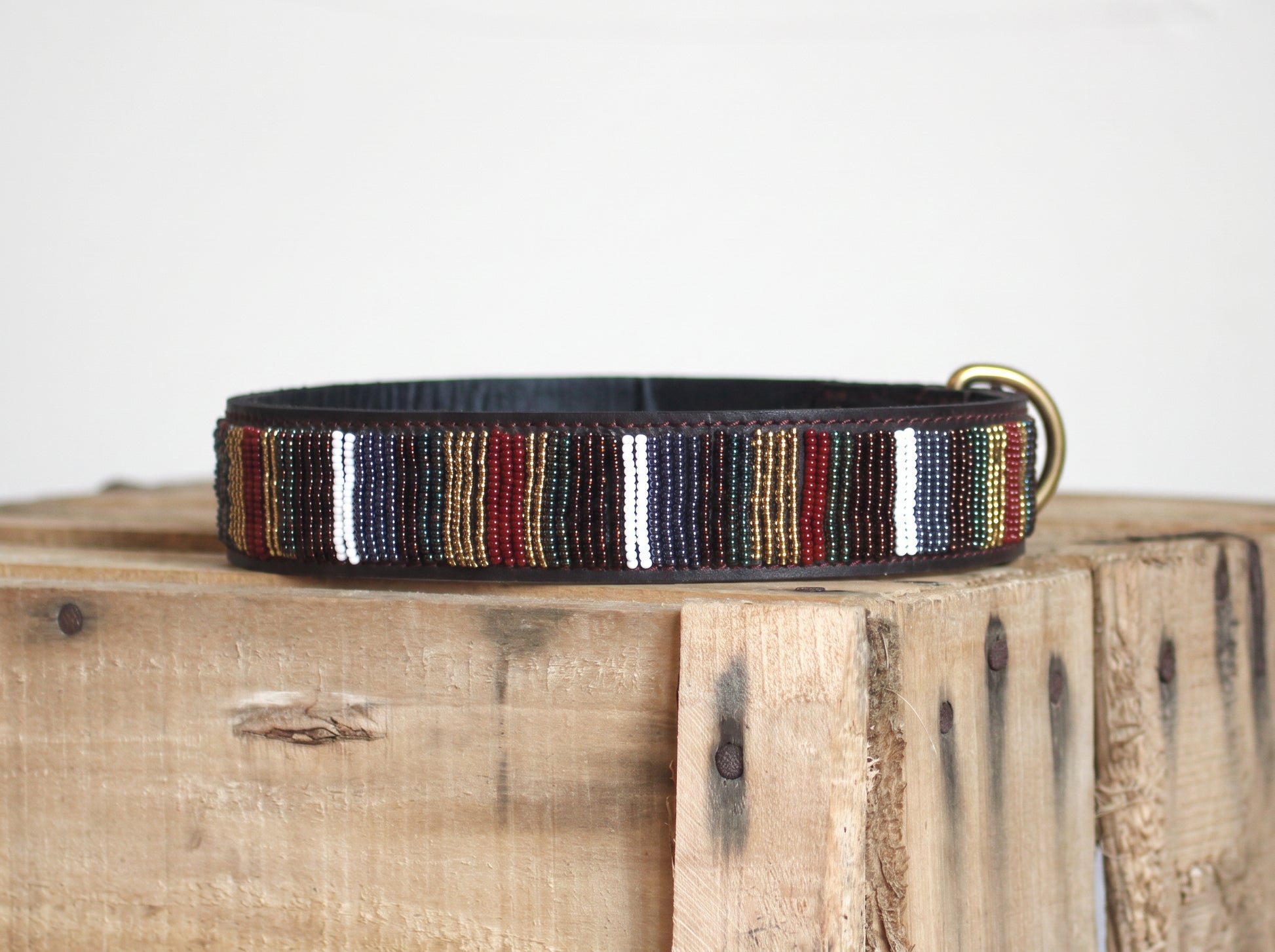 EL PASO beaded dog collar by COLLART on wooden crate